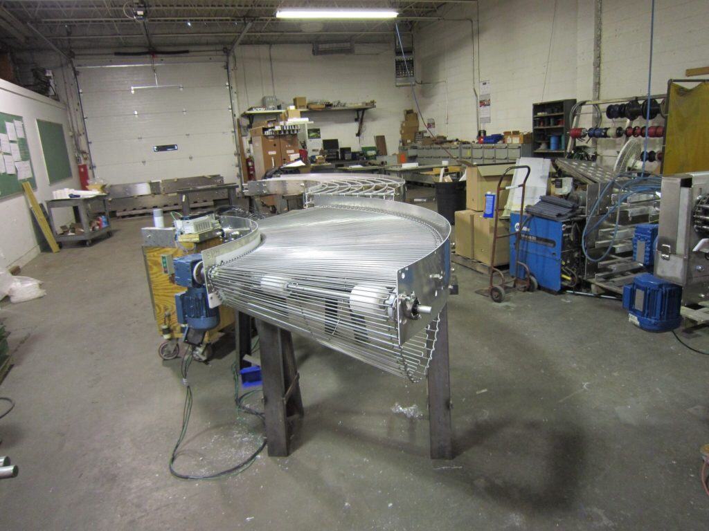 Curved conveyor unit under construction on the fabrication floor