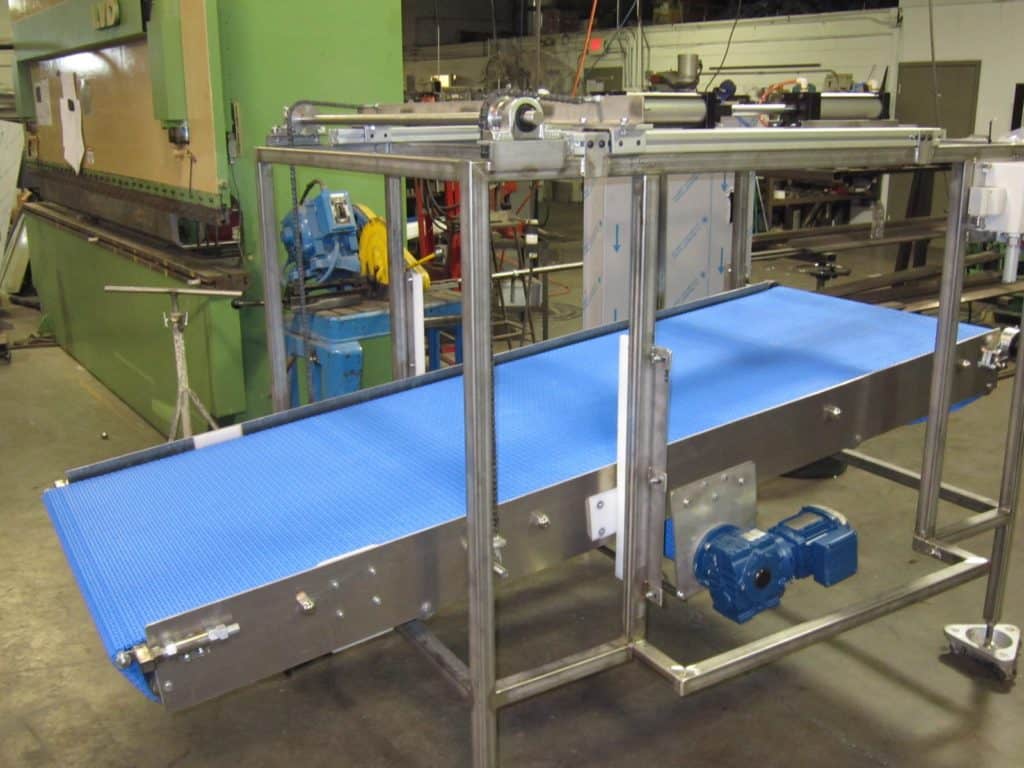 Belt conveyor on a stainless frame during fabrication in the shop
